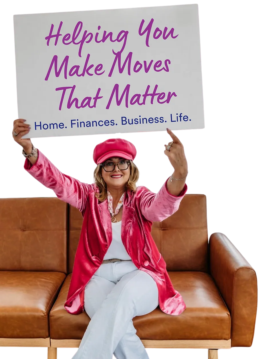 Michelle Castle holding a sign that reads Helping You Make Moves That Matter — Home. Finances. Business. Life.